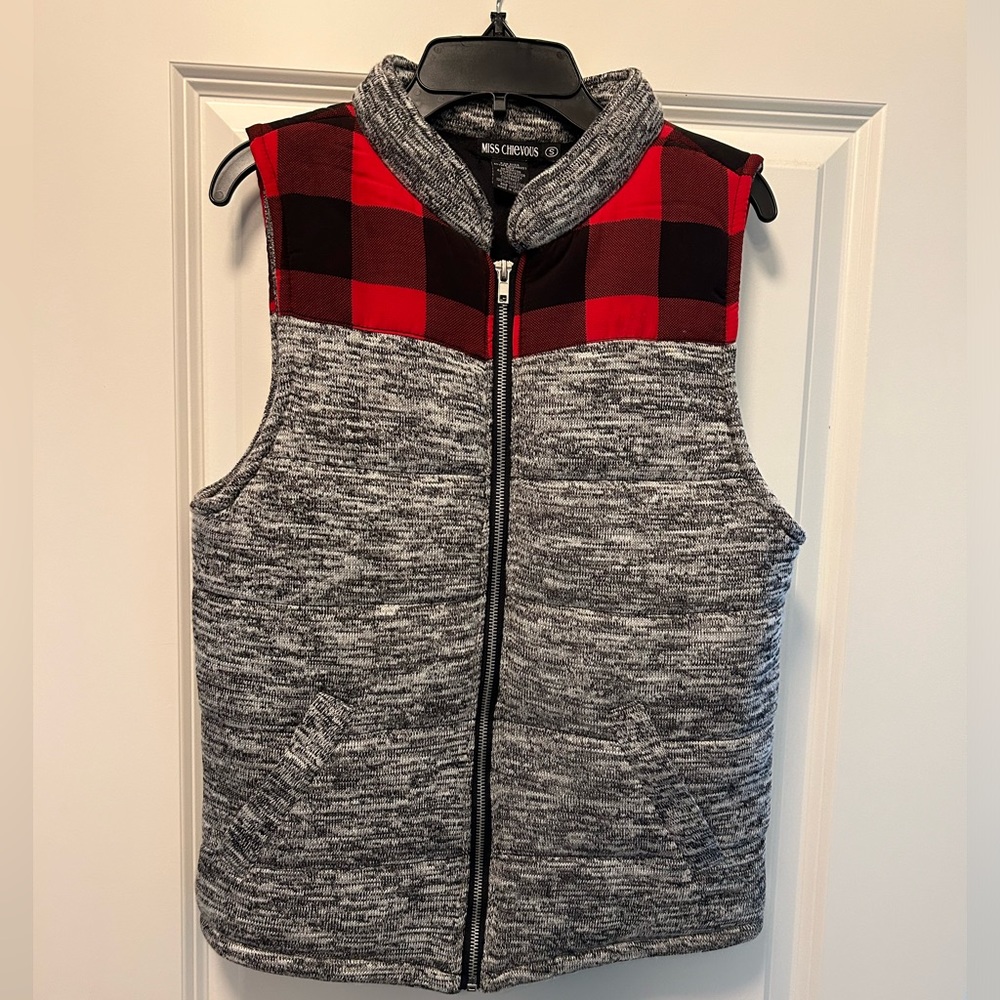 Heathered grey with red and black buffalo plaid across chest